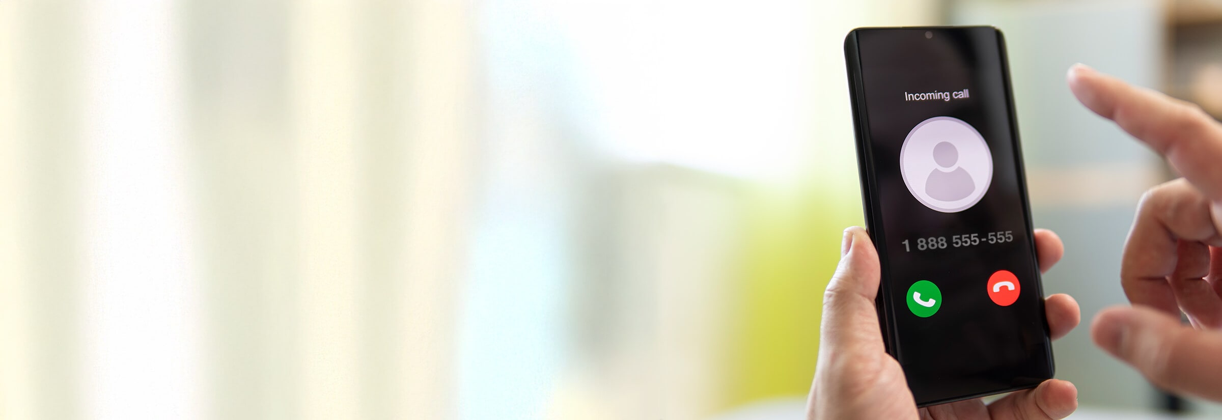 A person deciding whether to answer a 1-888 number.