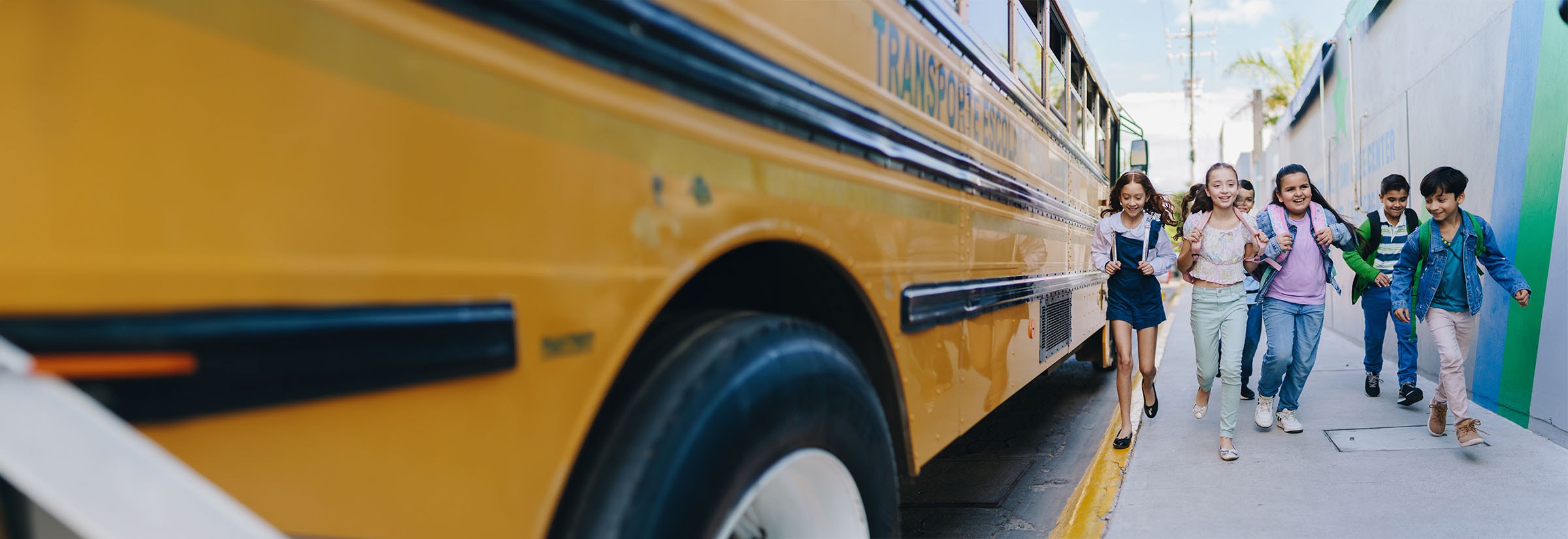 Students get ready to board a school bus