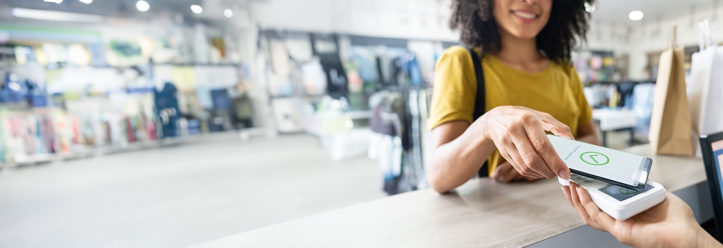 A person using the tap payment system on a mobile device.