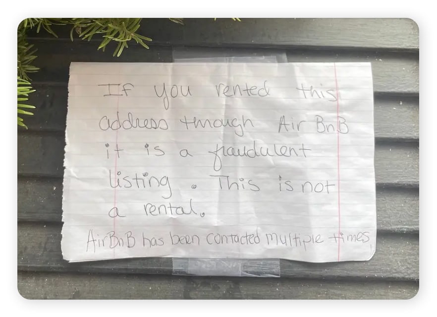 A note posted on the door of a Philadelphia home that scammers put on Airbnb.