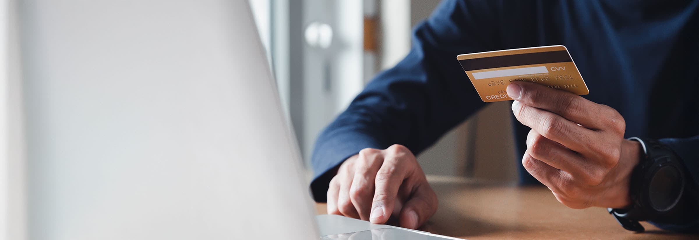 Somebody checking their credit card online to see if they were a victim of fraud.