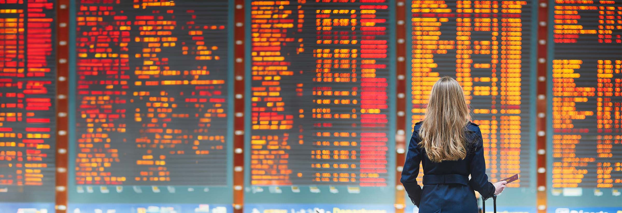 A person surfing on a tablet while at the airport.