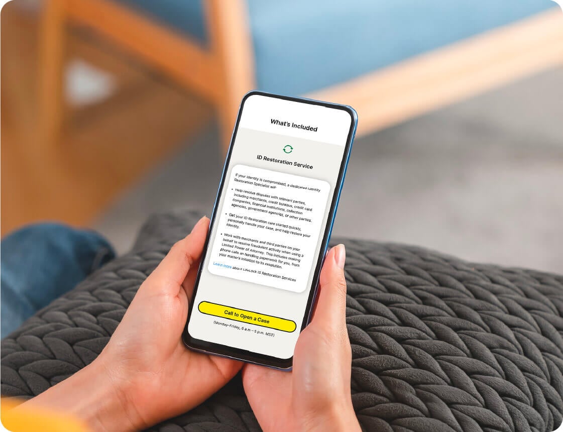 A woman uses the LifeLock app to get restoration support.