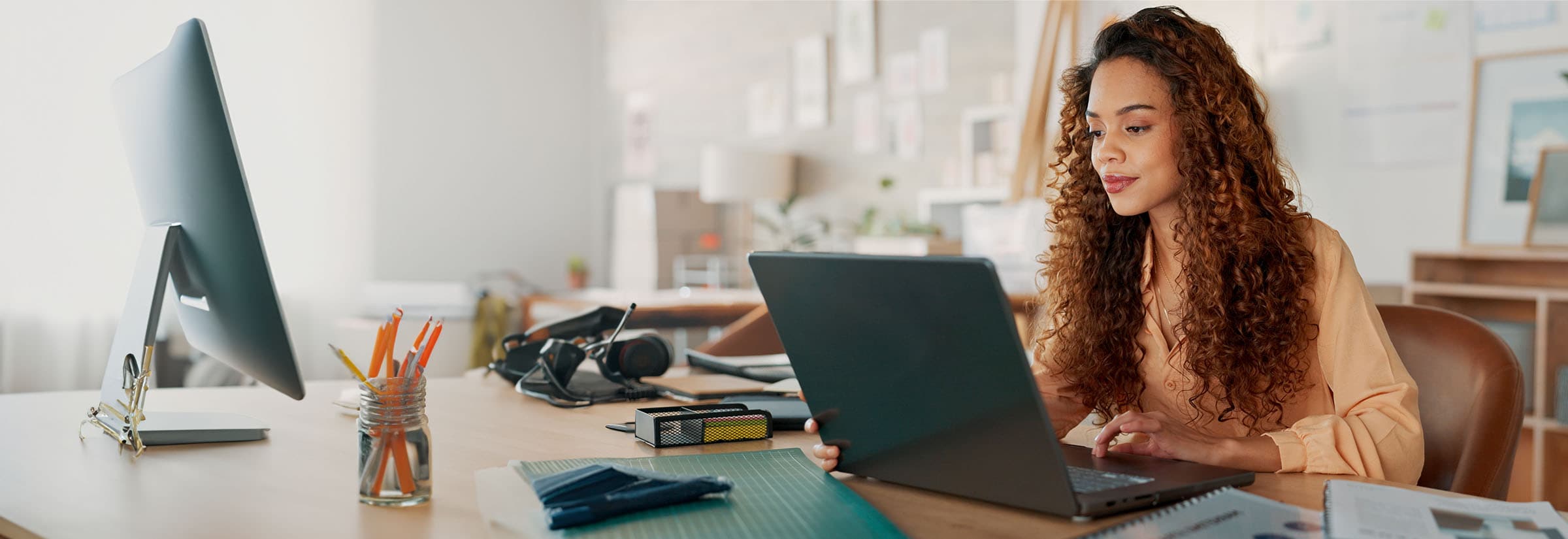 A person using a laptop to protect their Dropbox account from potential cyber threats.