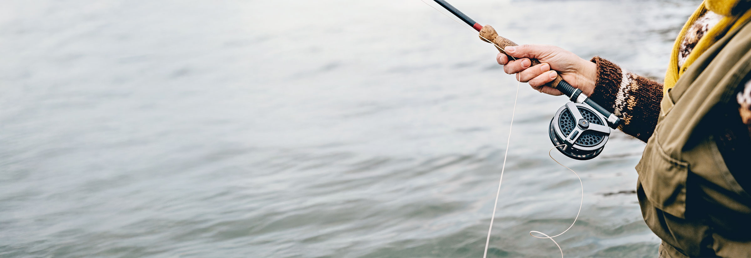 A person fishing, symbolizing phishing as a way hackers get passwords.