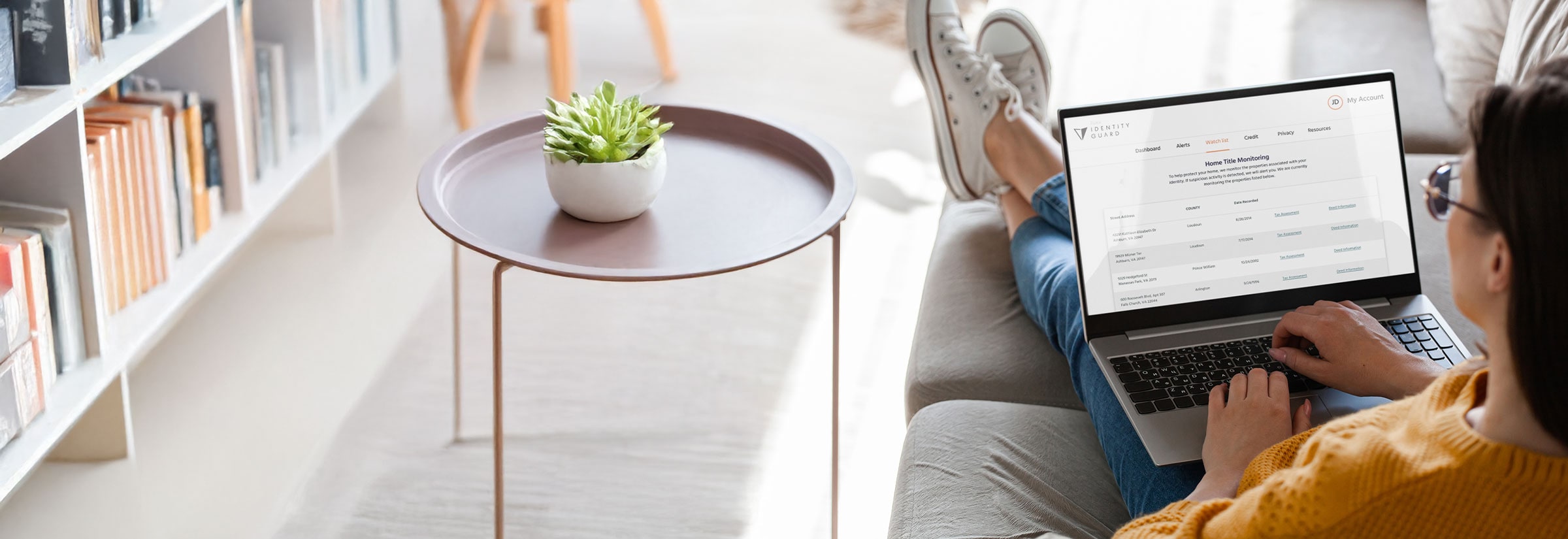 A person viewing the Identity Guard website on their computer.