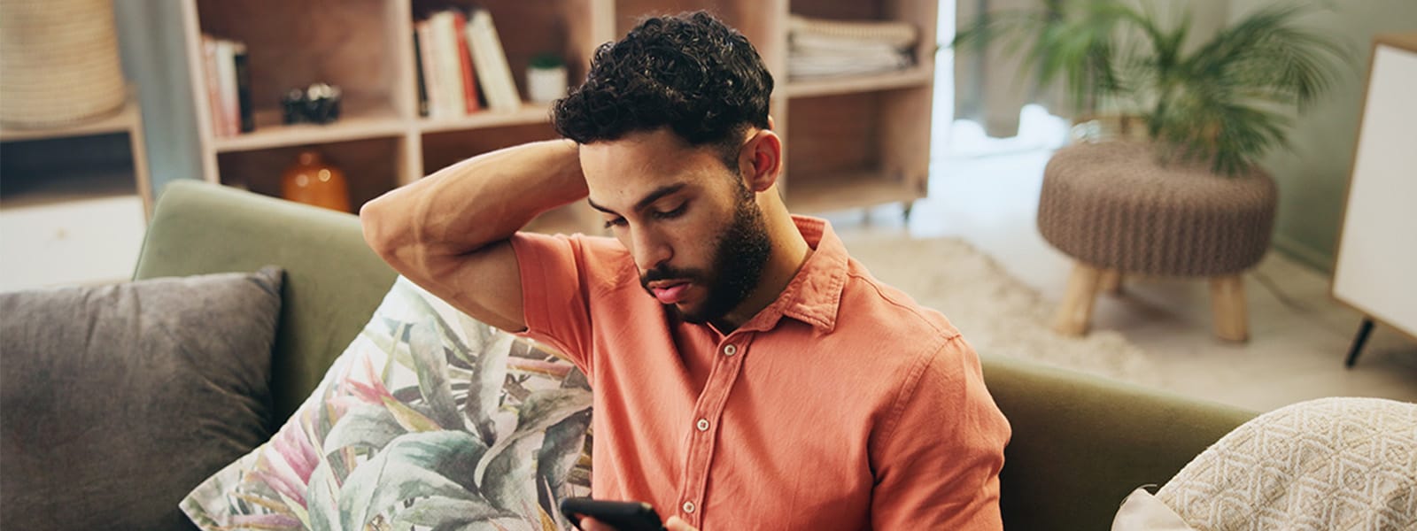 A man gets a notification on his phone about his social security number being exposed.