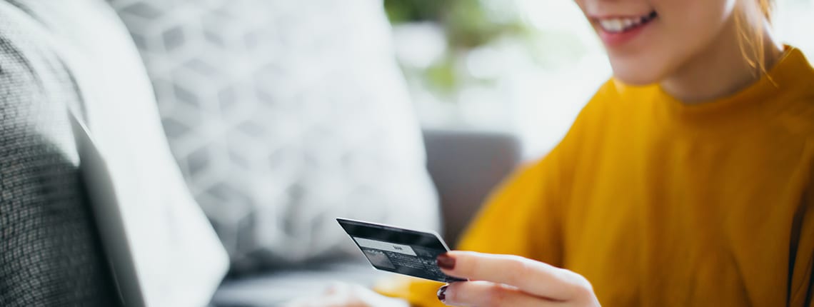 Woman purchasing something online with a credit card