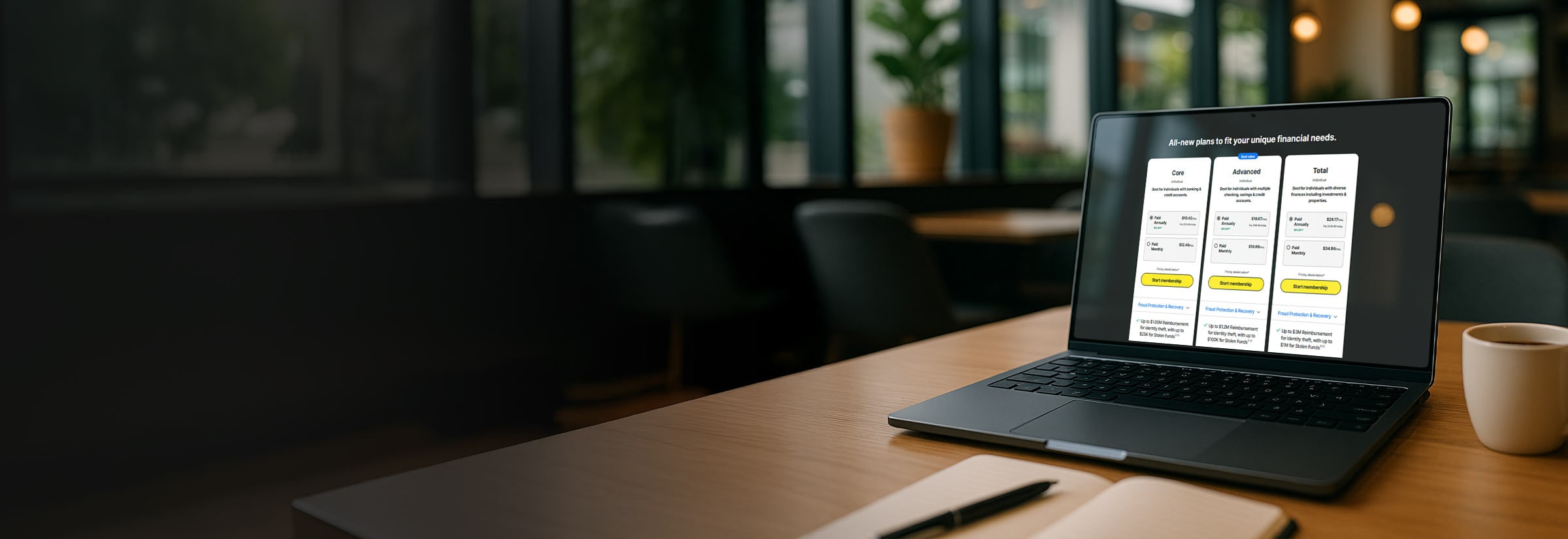 A laptop open on a webpage showing the three new LifeLock plans: Core, Advanced, and Total.