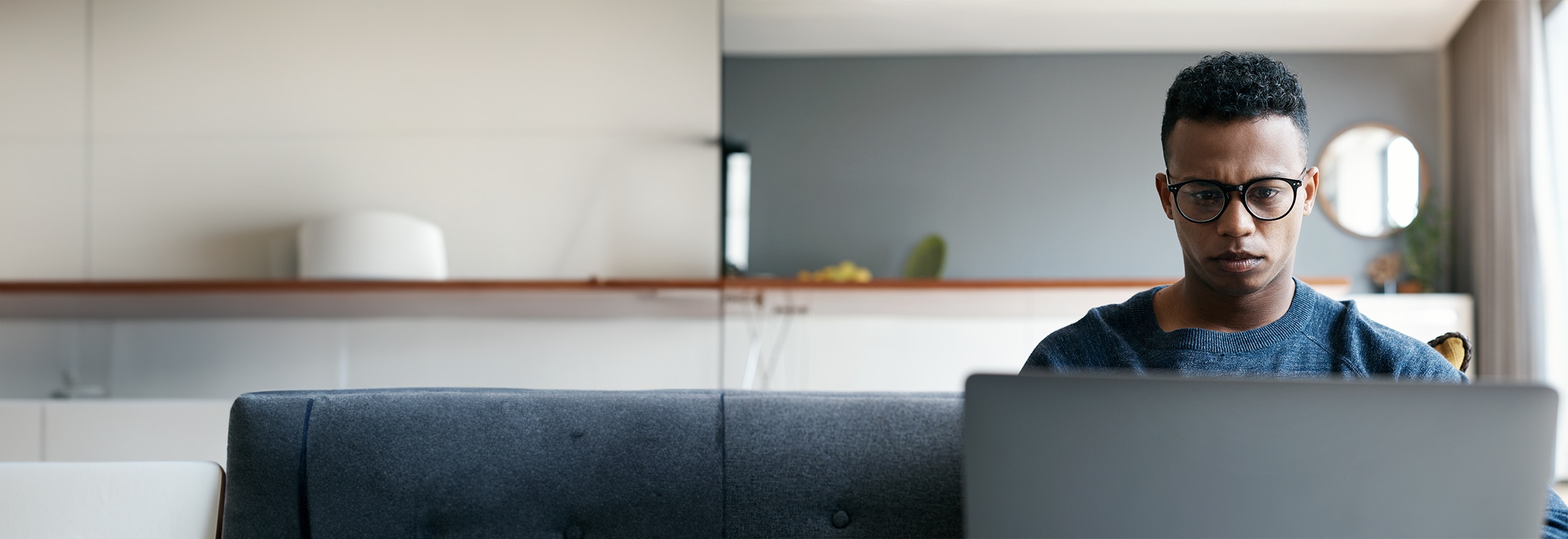 A person using a laptop to remove themselves from data broker sites.