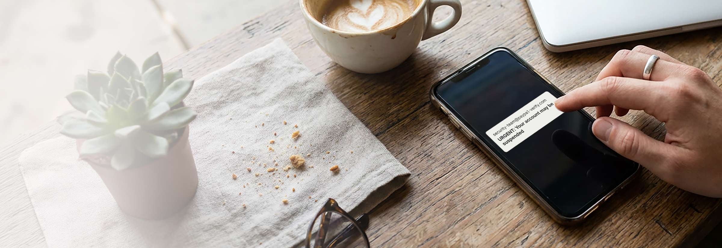 Someone reading a potentially spoofed text message on their phone.