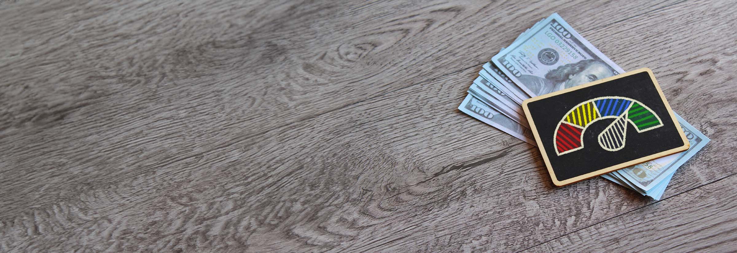 A score indicator on a stack of money, representing a credit score.