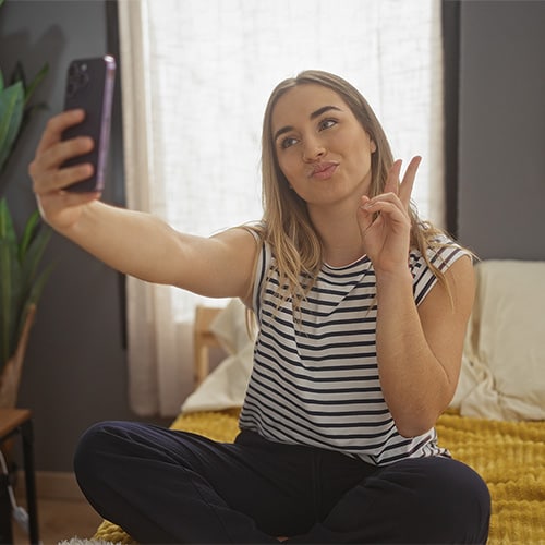 A man checks his Snapchat on his phone. 