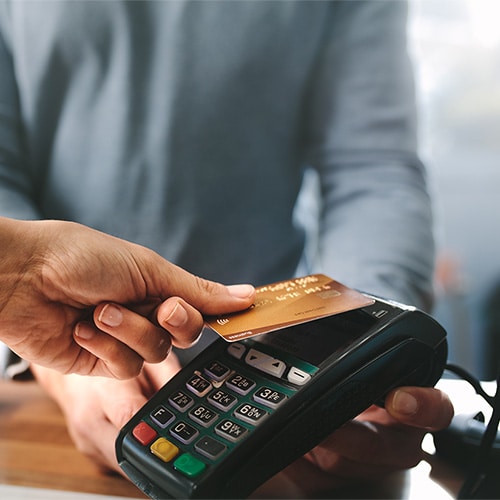 A credit card being used to make a contactless payment.