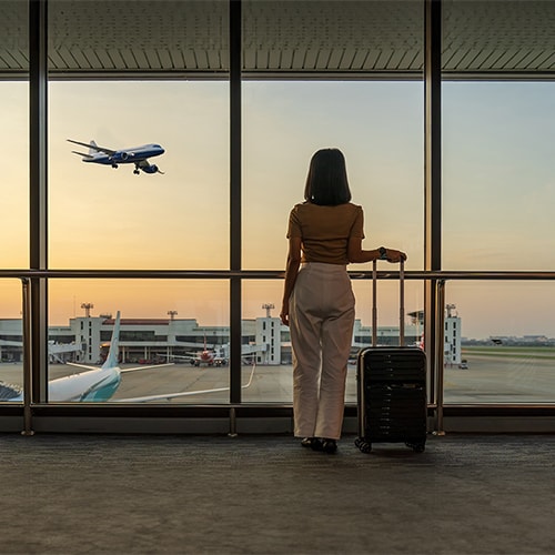 An image showing a woman reporting a lost passport at the airport.