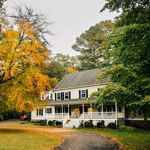 A picture depicts a house that may be at risk of home title theft.