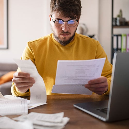 What is tax identity theft and how does it occur?