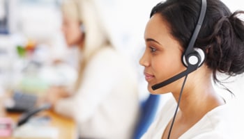 Female call agent wearing headset