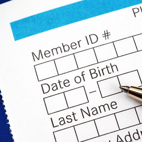 A paper form containing data fields for personally identifiable information (PII).